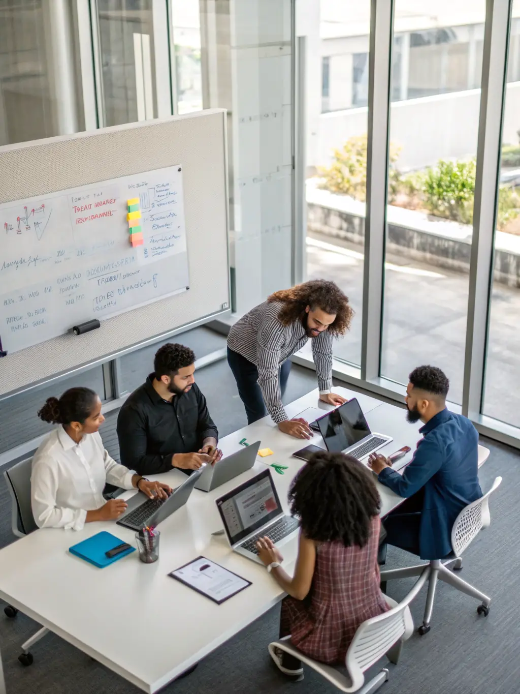 A professional photo of a diverse team of IT specialists collaborating in a modern office environment, symbolizing Netexpress's collaborative approach to providing IT solutions.